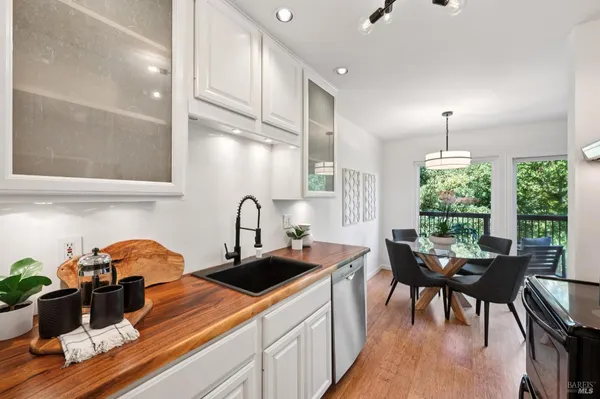 a kitchen that has a table and chairs in it