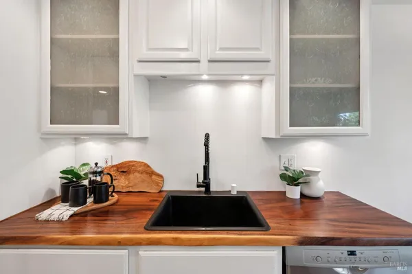 a kitchen with a sink and cabinets