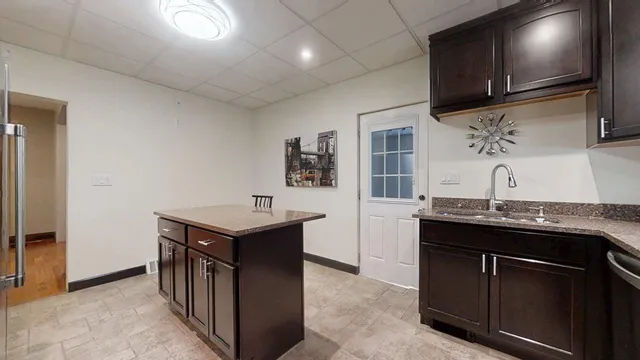 a utility room with cabinets dryer and washer