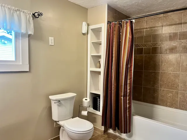 a bathroom with a sink vanity and a mirror