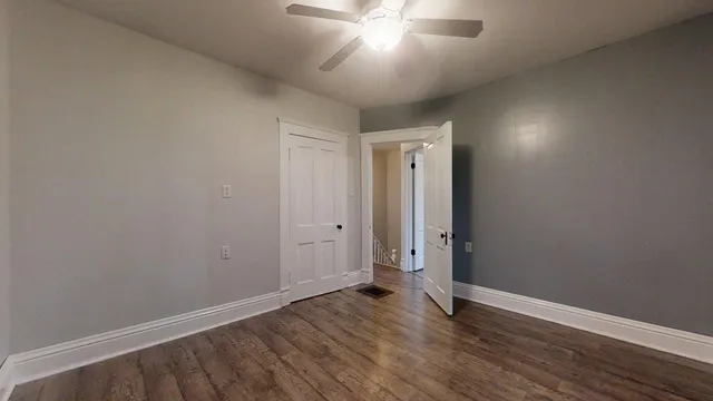 a view of a small space with wooden floor