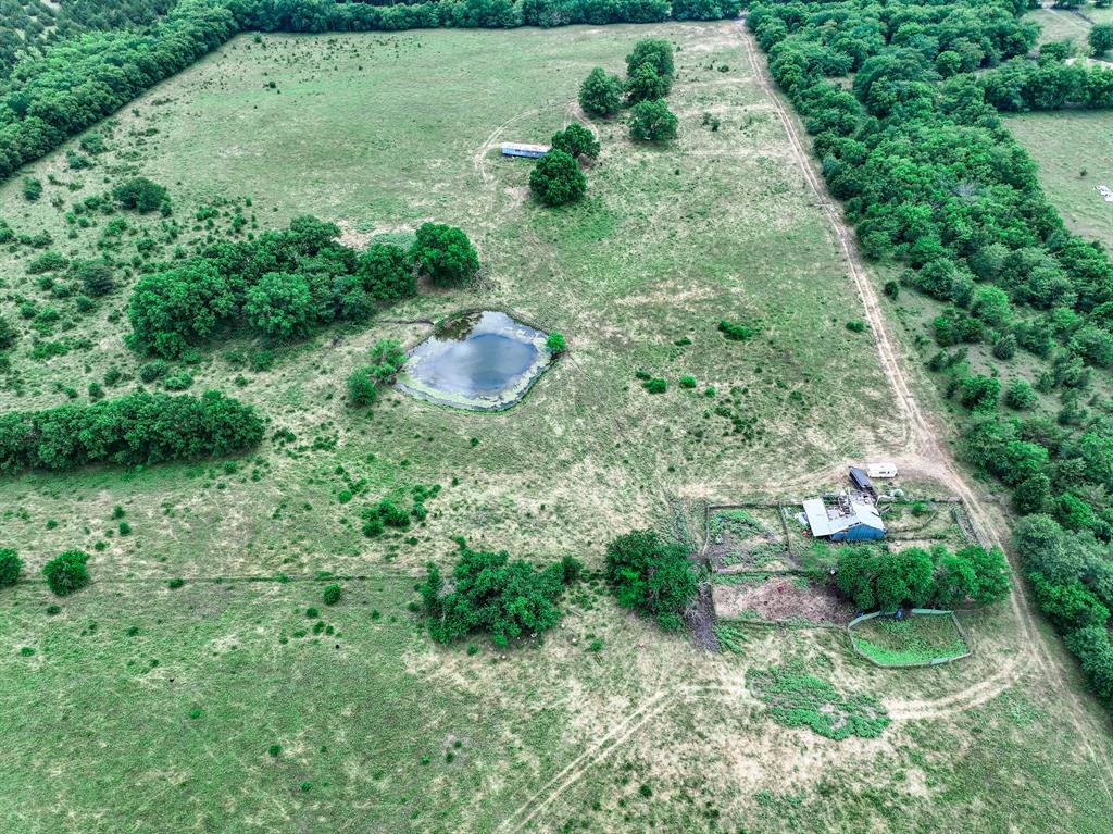 2190 County Road 2190 Commerce, TX 75428 - Photo 22 of 35 an aerial view of residential house with outdoor space