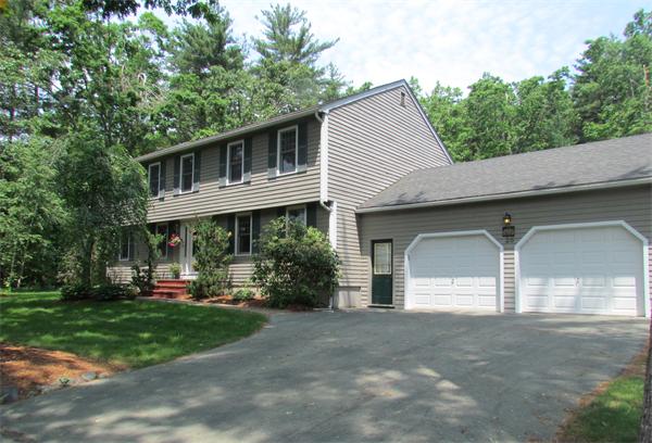 26 Nashaway Road Bolton, MA 01740 - Photo 1 of 15 a front view of a house with a yard and trees