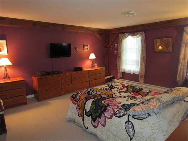 26 Nashaway Road Bolton, MA 01740 - Photo 11 of 15 a bed room with a bed and a television