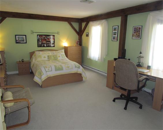 26 Nashaway Road Bolton, MA 01740 - Photo 12 of 15 a bedroom with a bed chair and window