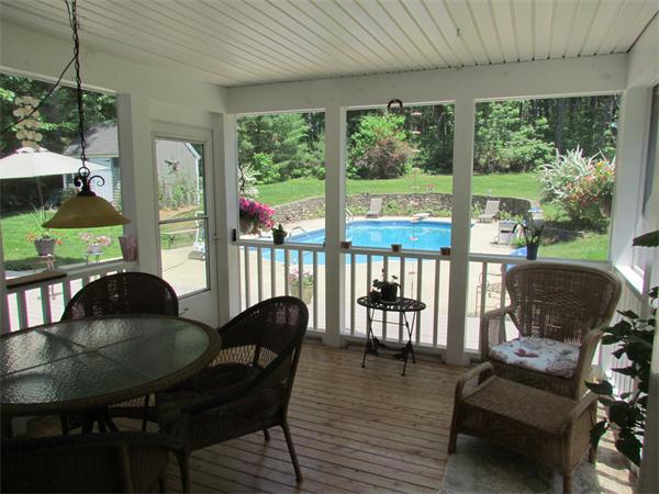 26 Nashaway Road Bolton, MA 01740 - Photo 3 of 15 a living room with furniture and a floor to ceiling window