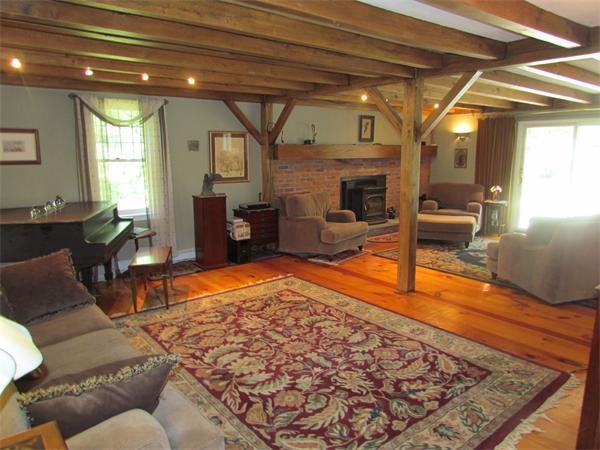 26 Nashaway Road Bolton, MA 01740 - Photo 4 of 15 a living room with furniture and a fireplace