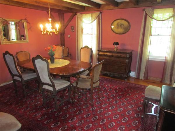 26 Nashaway Road Bolton, MA 01740 - Photo 7 of 15 a view of a dining room with furniture and chandelier