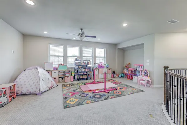 a living room with furniture and white walls