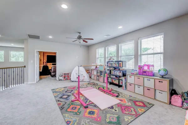 a bed room with furniture and a wooden floor