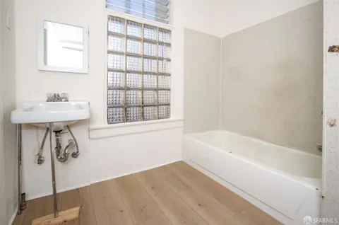 a bathroom with a bathtub and a sink