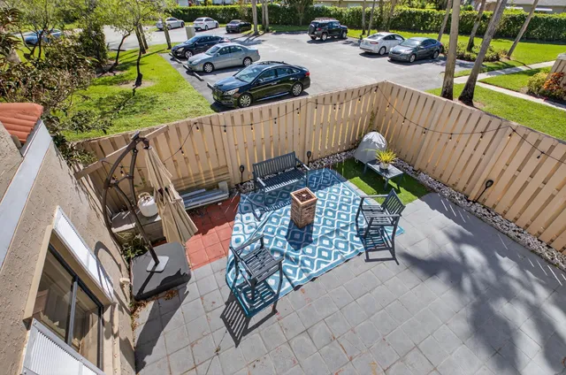 a bathroom with a tub a sink and mirror