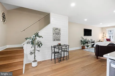 a view of a livingroom with furniture and wooden floor