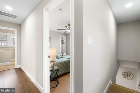 a view of a bedroom from a hallway