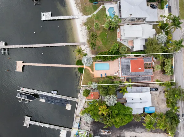 an aerial view of a houses with a street