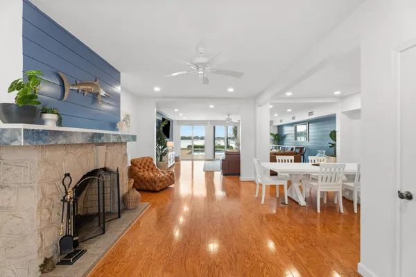 a dining room with furniture and floor to ceiling window