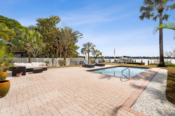 a view of swimming pool with chairs