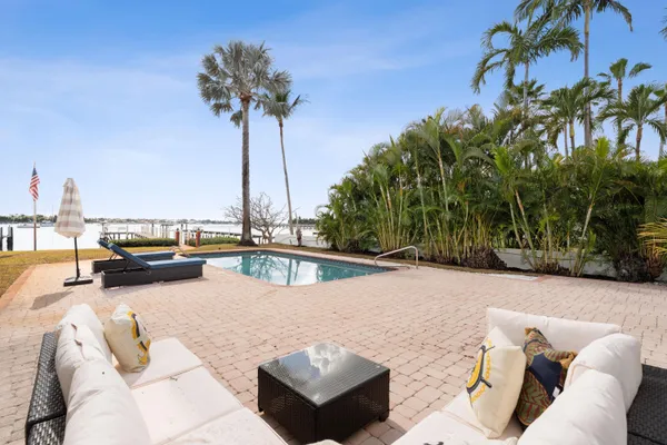 a view of swimming pool with seating space