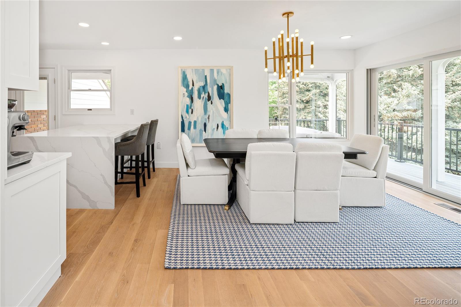 1 Hillside Drive Wheat Ridge, CO 80215 - Photo 14 of 50 a living room with furniture a window and a dining table