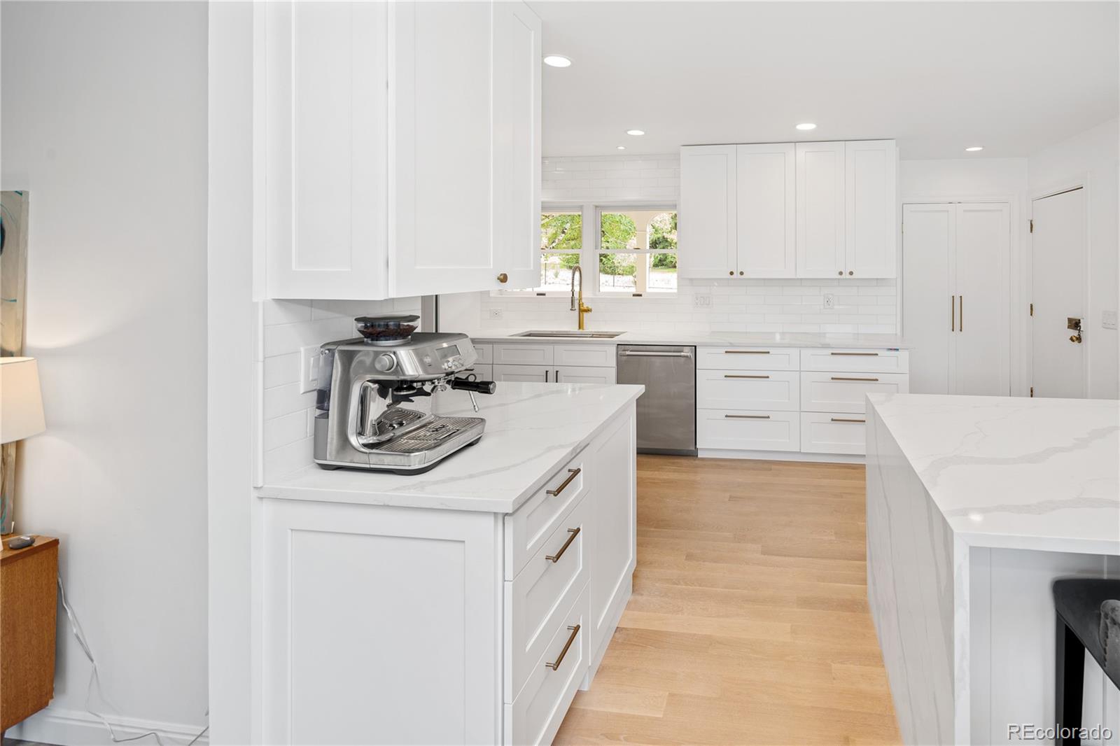 1 Hillside Drive Wheat Ridge, CO 80215 - Photo 18 of 50 a kitchen with a sink stove and cabinets