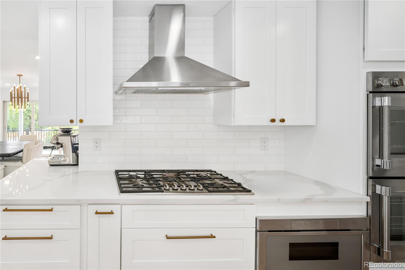1 Hillside Drive Wheat Ridge, CO 80215 - Photo 22 of 50 a white stove top oven sitting inside of a kitchen