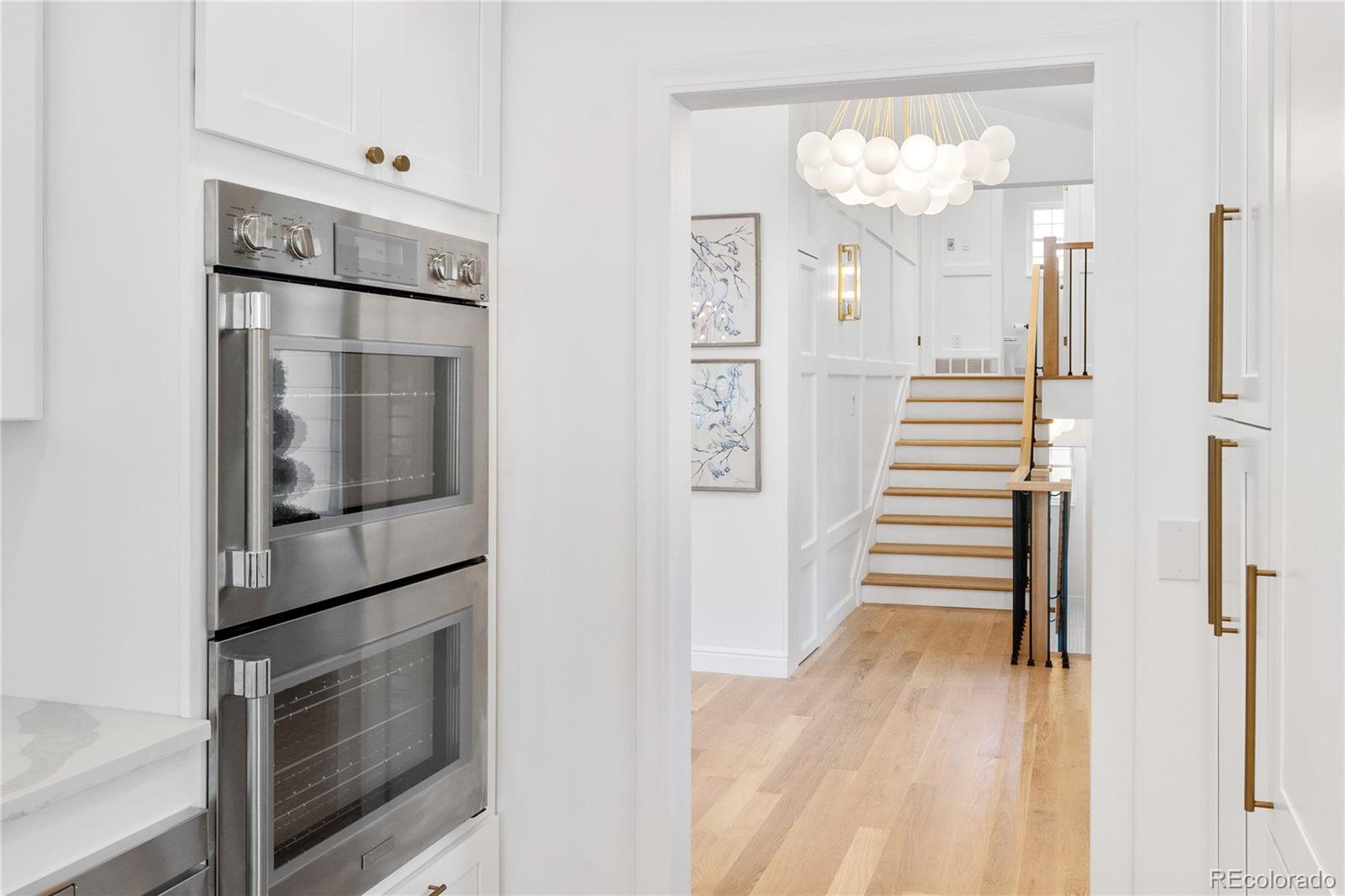 1 Hillside Drive Wheat Ridge, CO 80215 - Photo 23 of 50 a kitchen with cabinets and stainless steel appliances
