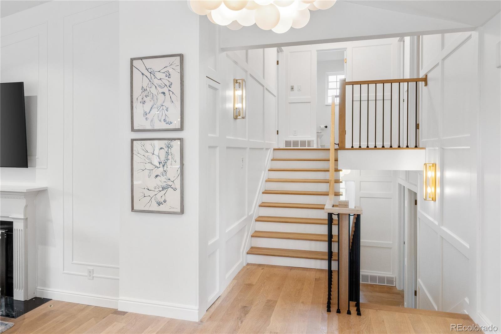 1 Hillside Drive Wheat Ridge, CO 80215 - Photo 24 of 50 a view of entryway with stairs and wooden floor