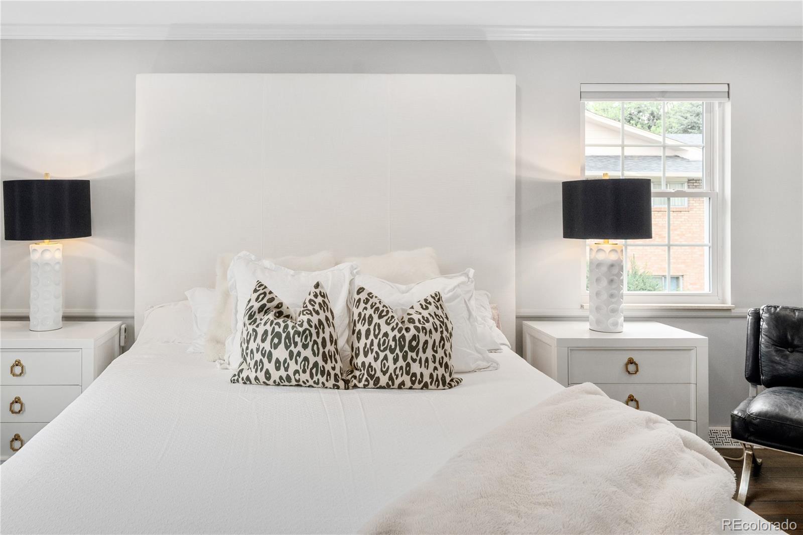 1 Hillside Drive Wheat Ridge, CO 80215 - Photo 26 of 50 a bedroom with a bed window and a flat screen tv