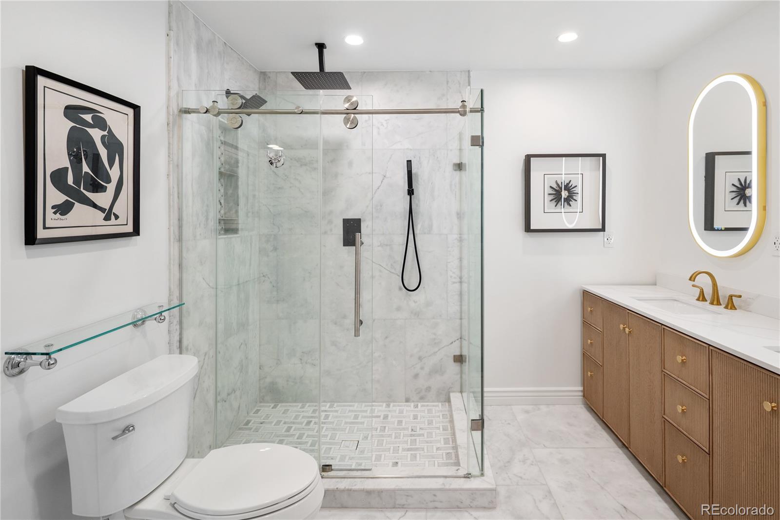 1 Hillside Drive Wheat Ridge, CO 80215 - Photo 28 of 50 a bathroom with a toilet sink and shower