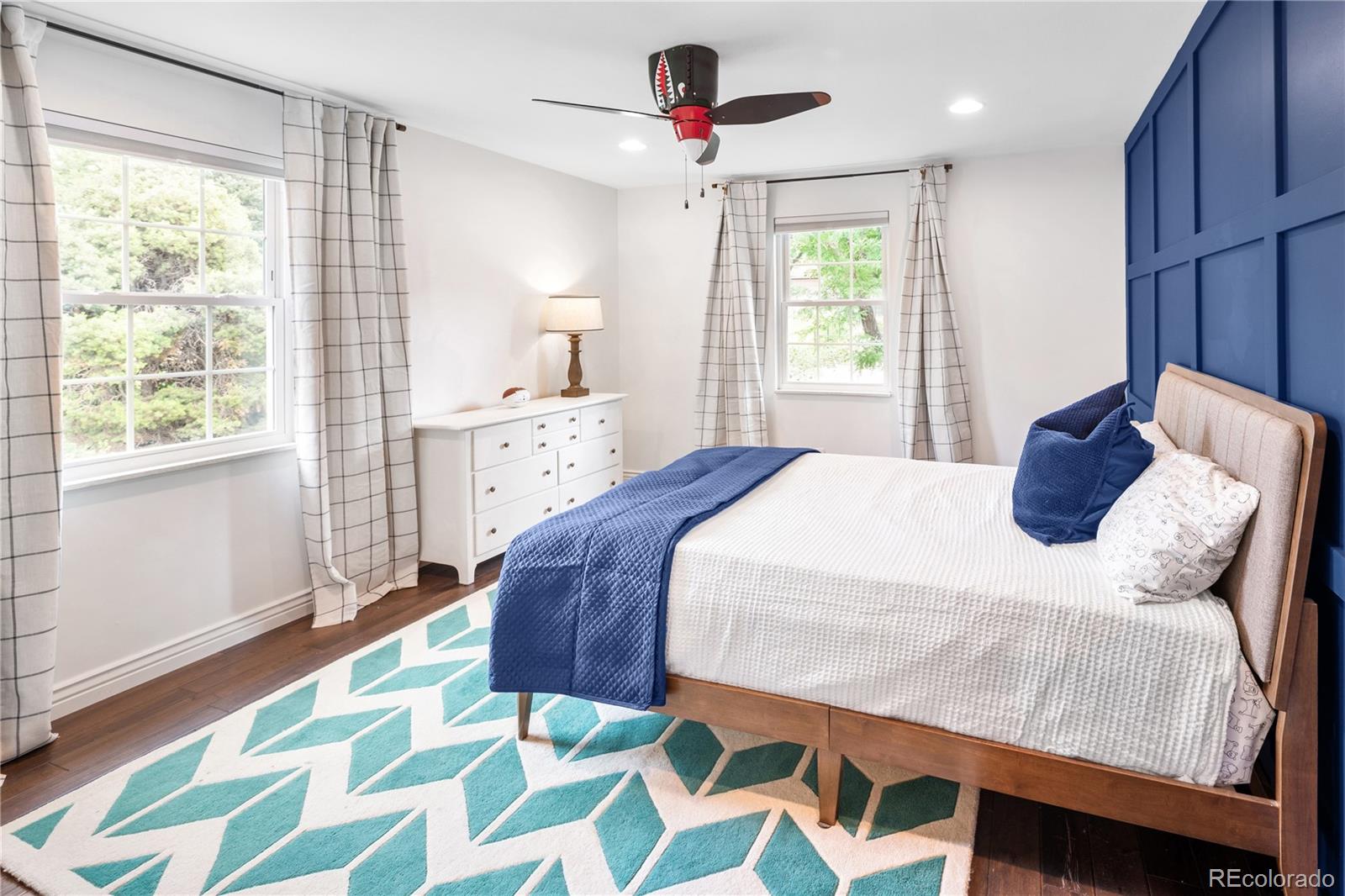 1 Hillside Drive Wheat Ridge, CO 80215 - Photo 33 of 50 a bedroom with a bed and a chandelier