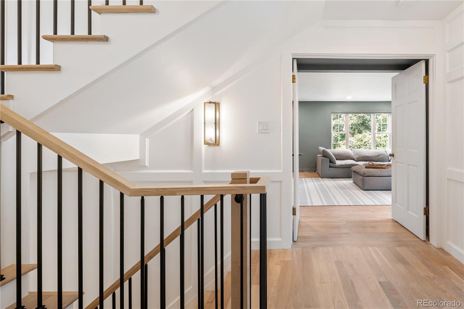 1 Hillside Drive Wheat Ridge, CO 80215 - Photo 35 of 50 a view of a hallway with wooden floor and entryway