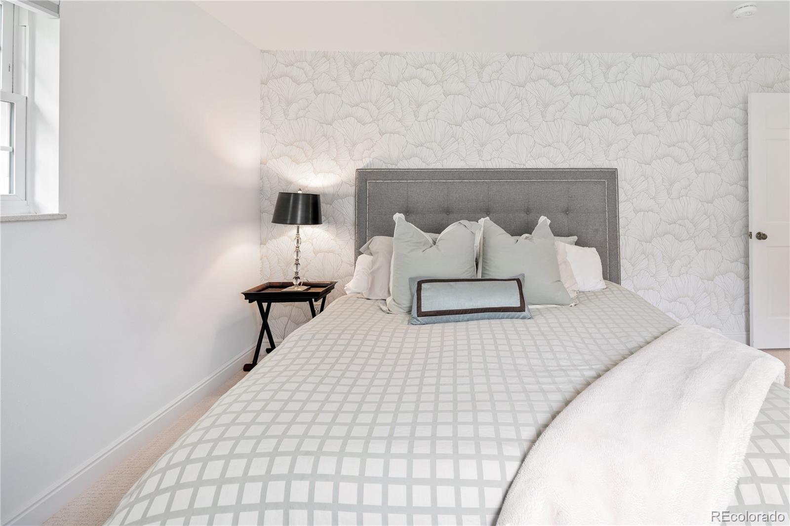 1 Hillside Drive Wheat Ridge, CO 80215 - Photo 39 of 50 a bedroom with a bed and a night stand