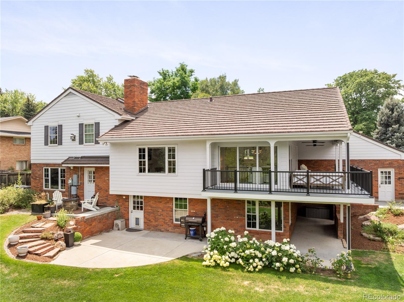 1 Hillside Drive Wheat Ridge, CO 80215 - Photo 43 of 50 a front view of a house with garden and porch