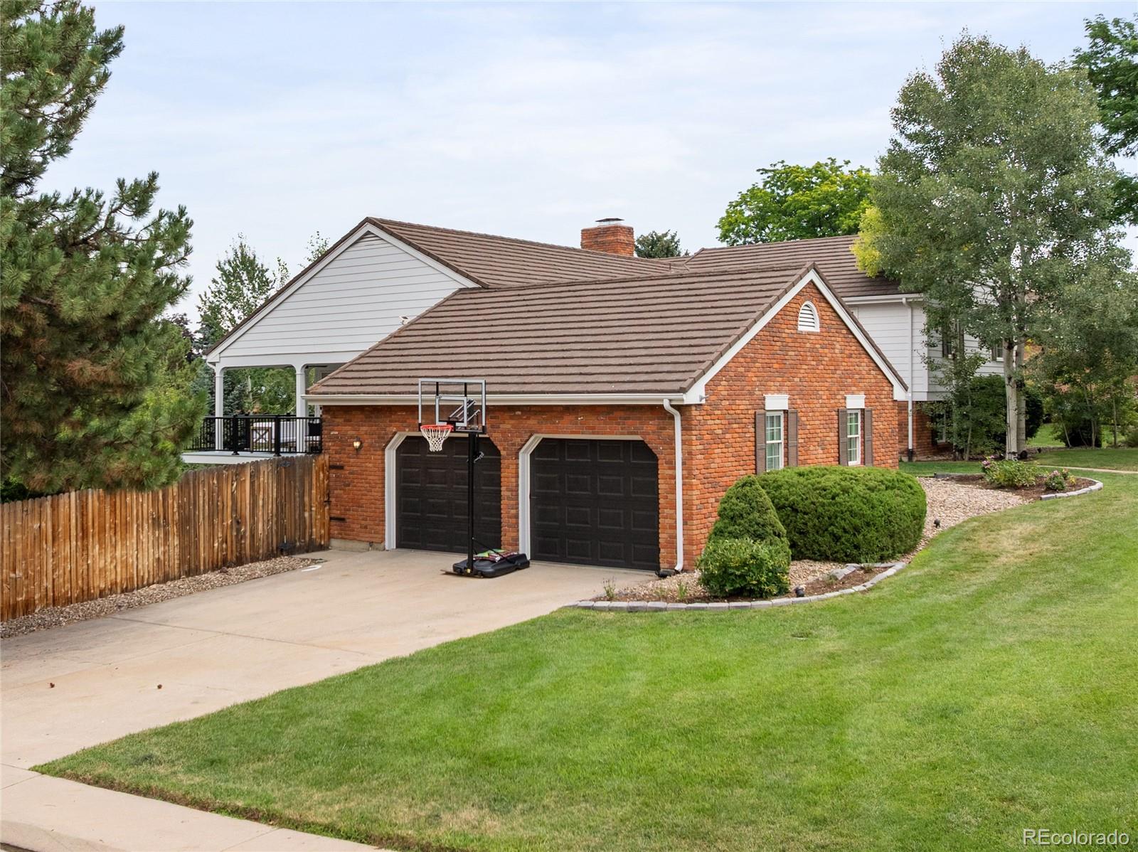 1 Hillside Drive Wheat Ridge, CO 80215 - Photo 44 of 50 a view of a house with a yard and plants