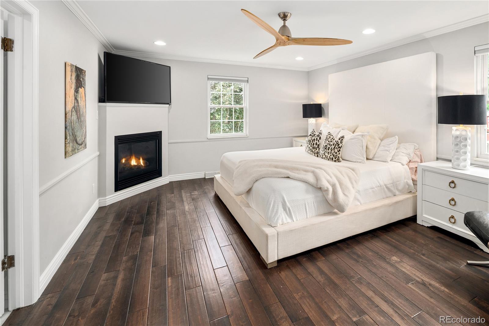 1 Hillside Drive Wheat Ridge, CO 80215 - Photo 6 of 50 a bedroom with a bed and a fireplace