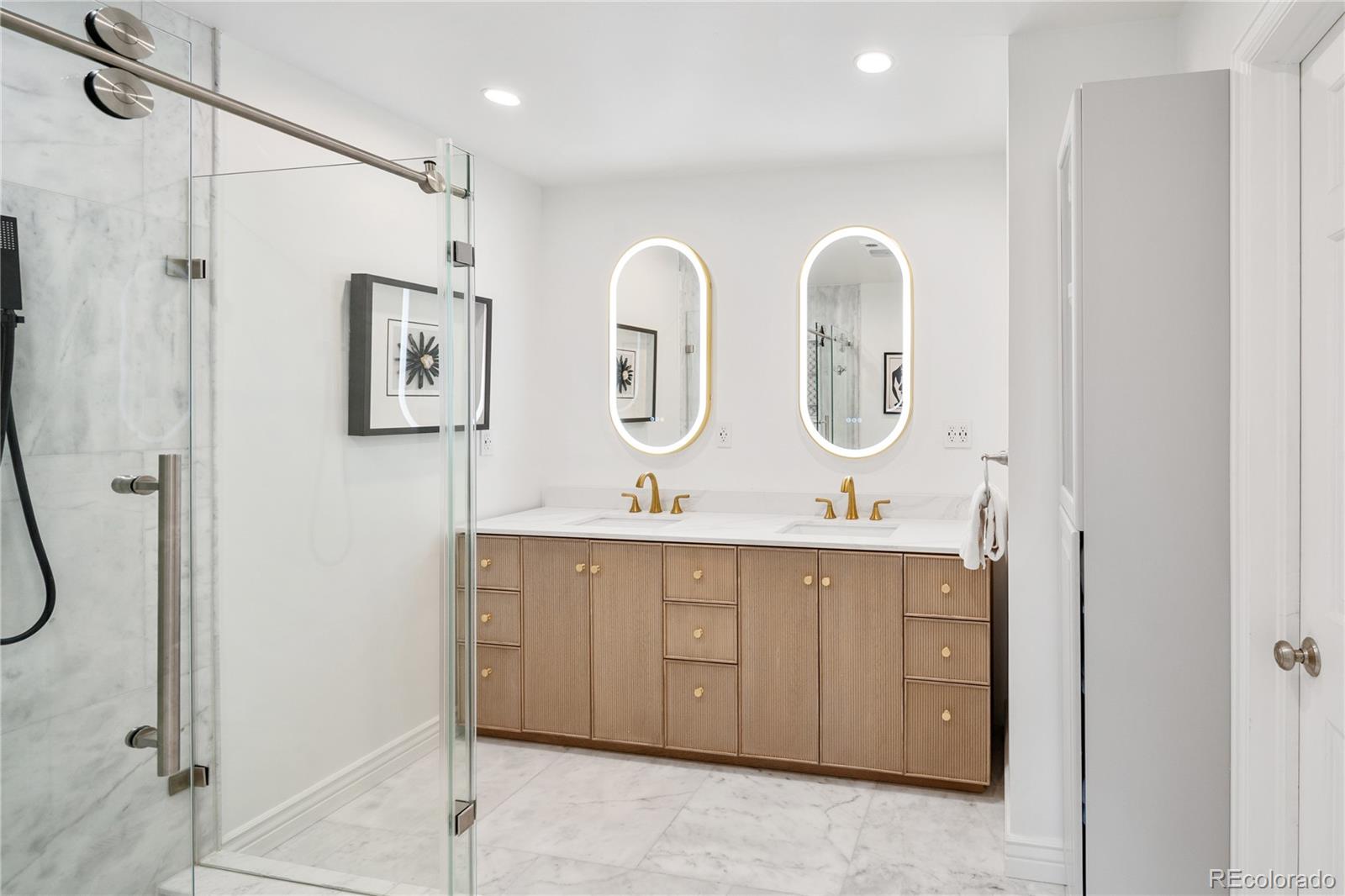 1 Hillside Drive Wheat Ridge, CO 80215 - Photo 7 of 50 a bathroom with double vanity sinks and a shower