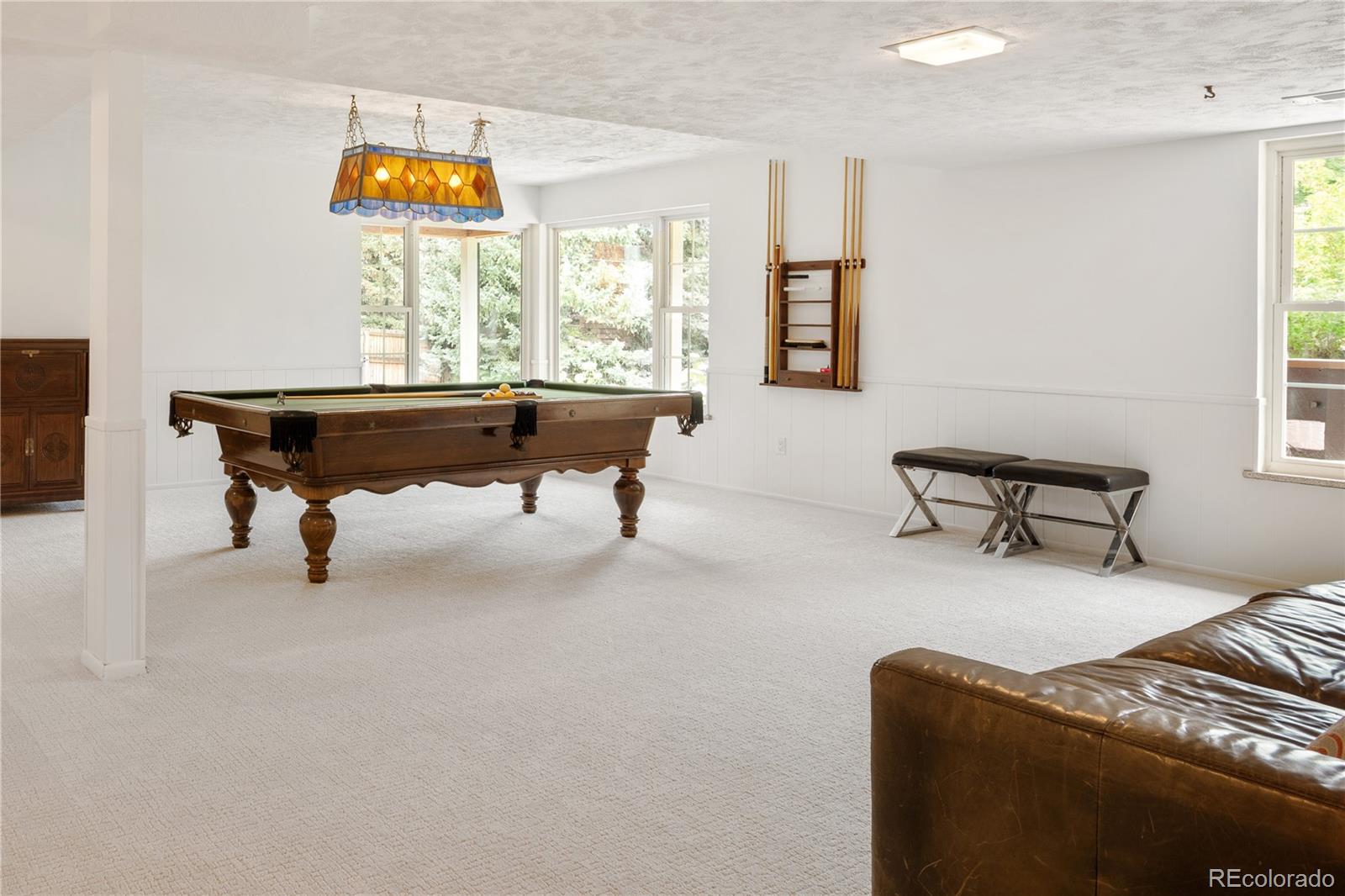 1 Hillside Drive Wheat Ridge, CO 80215 - Photo 9 of 50 a living room with furniture a table and a window