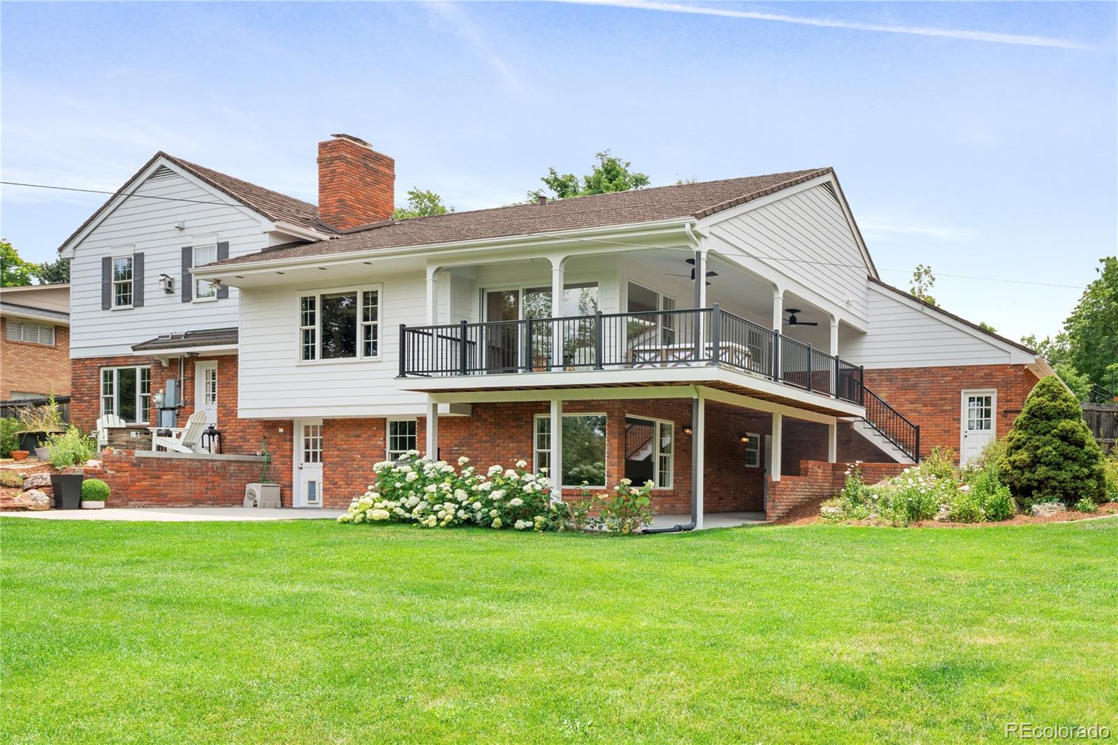 1 Hillside Drive Wheat Ridge, CO 80215 - Photo 10 of 50 a front view of a house with garden