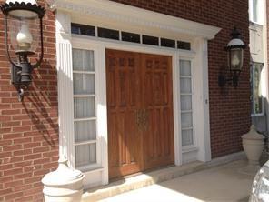 a potted plant sitting in front of a door