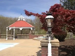 a backyard of a house with table and chairs