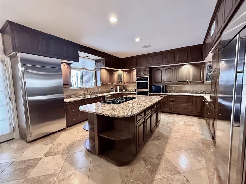 206 Fairview Road Pittsburgh, PA 15238 - Photo 14 of 29 a kitchen with stainless steel appliances granite countertop a sink a stove and a refrigerator