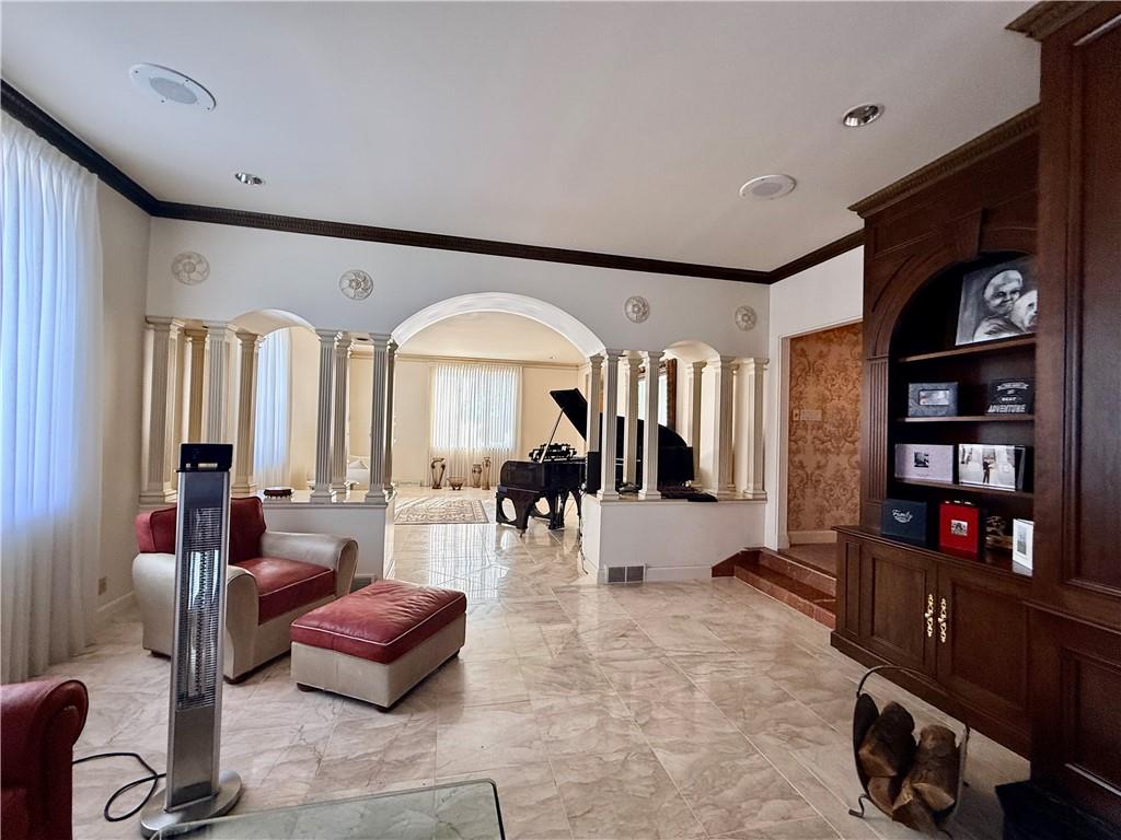 206 Fairview Road Pittsburgh, PA 15238 - Photo 10 of 29 a living room with furniture a bookshelf and a large window