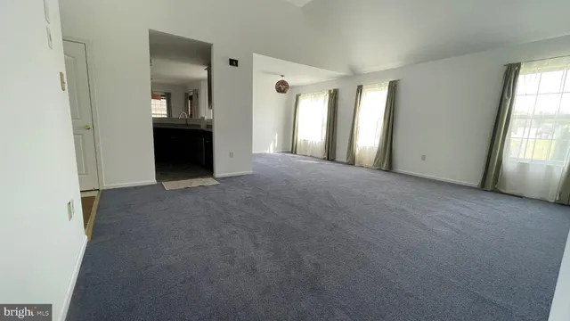 a view of a big room with windows and bathroom view