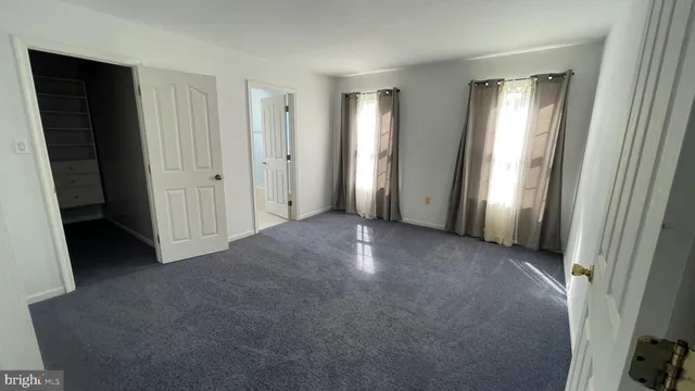 a view of empty room with windows