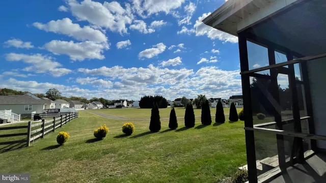 a view of a garden with an outdoor seating