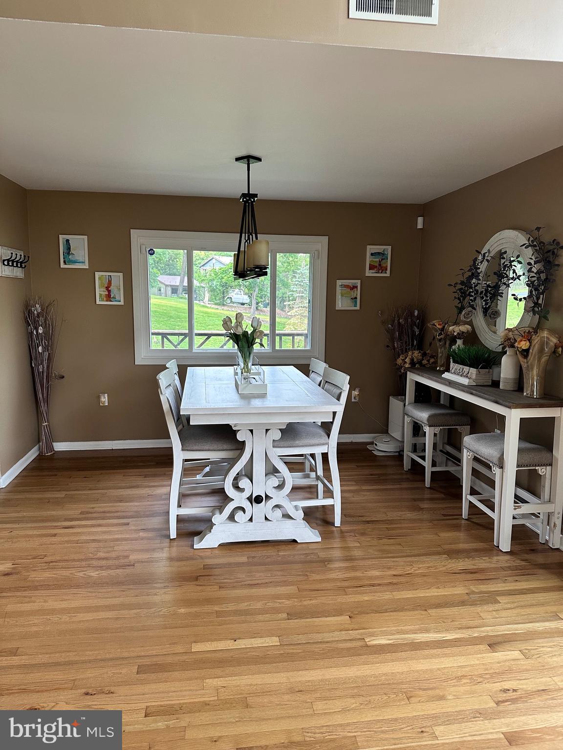 1801 Crums Mill Road Harrisburg, PA 17110 - Photo 4 of 29 a view of a dining room with furniture window and wooden floor