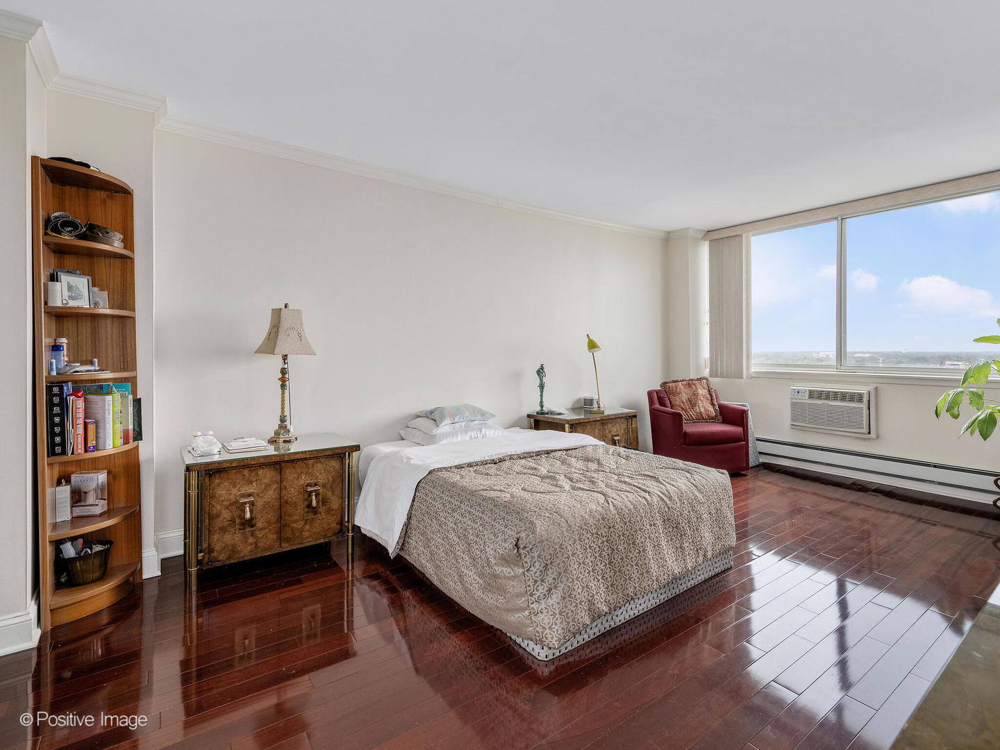 40 North Tower Road, Unit 12F Oak Brook, IL 60523 - Photo 13 of 25 a bedroom with a bed and a book shelf