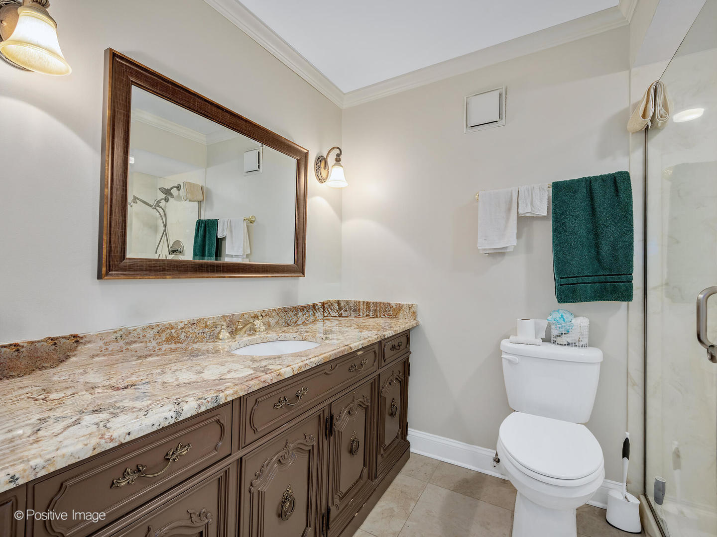 40 North Tower Road, Unit 12F Oak Brook, IL 60523 - Photo 14 of 25 a bathroom with a toilet a sink and mirror