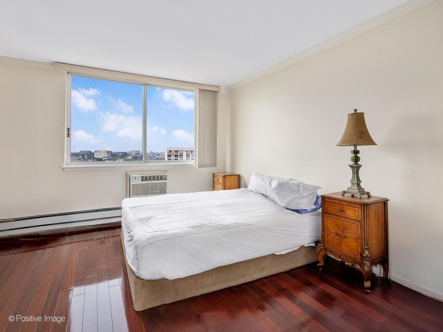 40 North Tower Road, Unit 12F Oak Brook, IL 60523 - Photo 16 of 25 a bed sitting in a bedroom next to a window