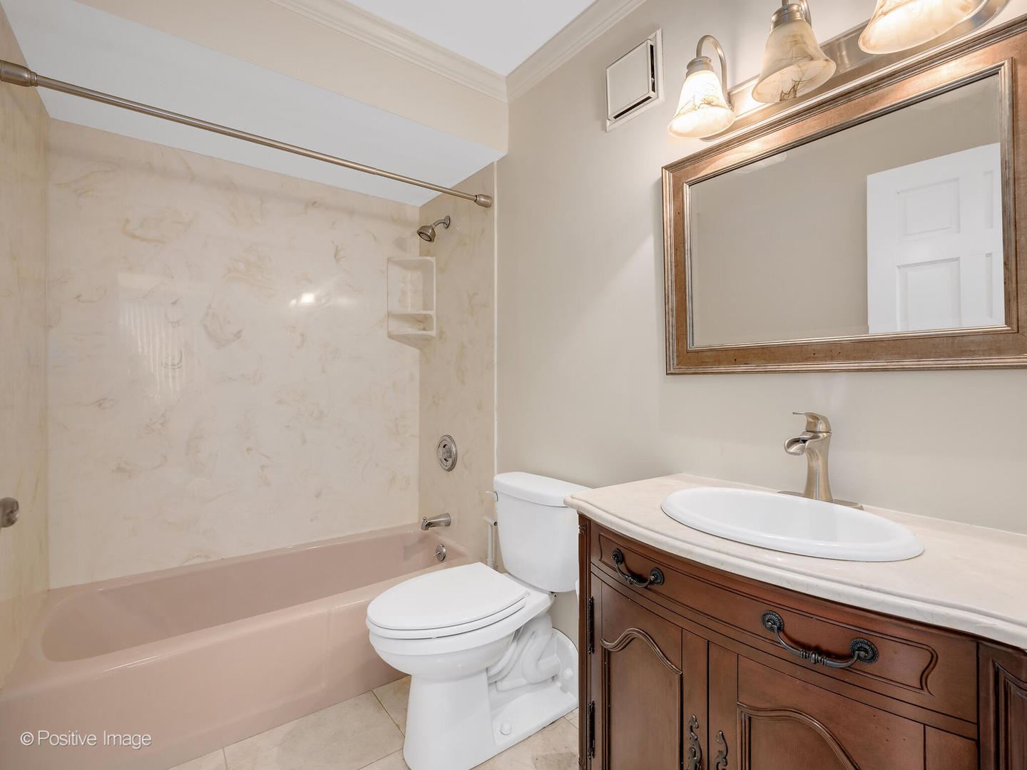 40 North Tower Road, Unit 12F Oak Brook, IL 60523 - Photo 17 of 25 a bathroom with a sink a toilet a mirror and shower